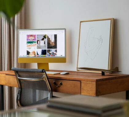 a desktop computer sitting on top of a wooden desk
