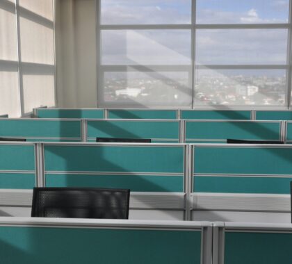 black leather chair beside glass window